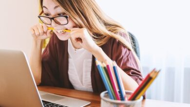 Student revising for exams with a laptop
