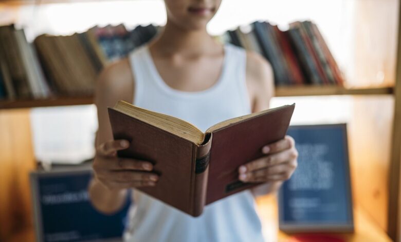 University students walking across a campus with books